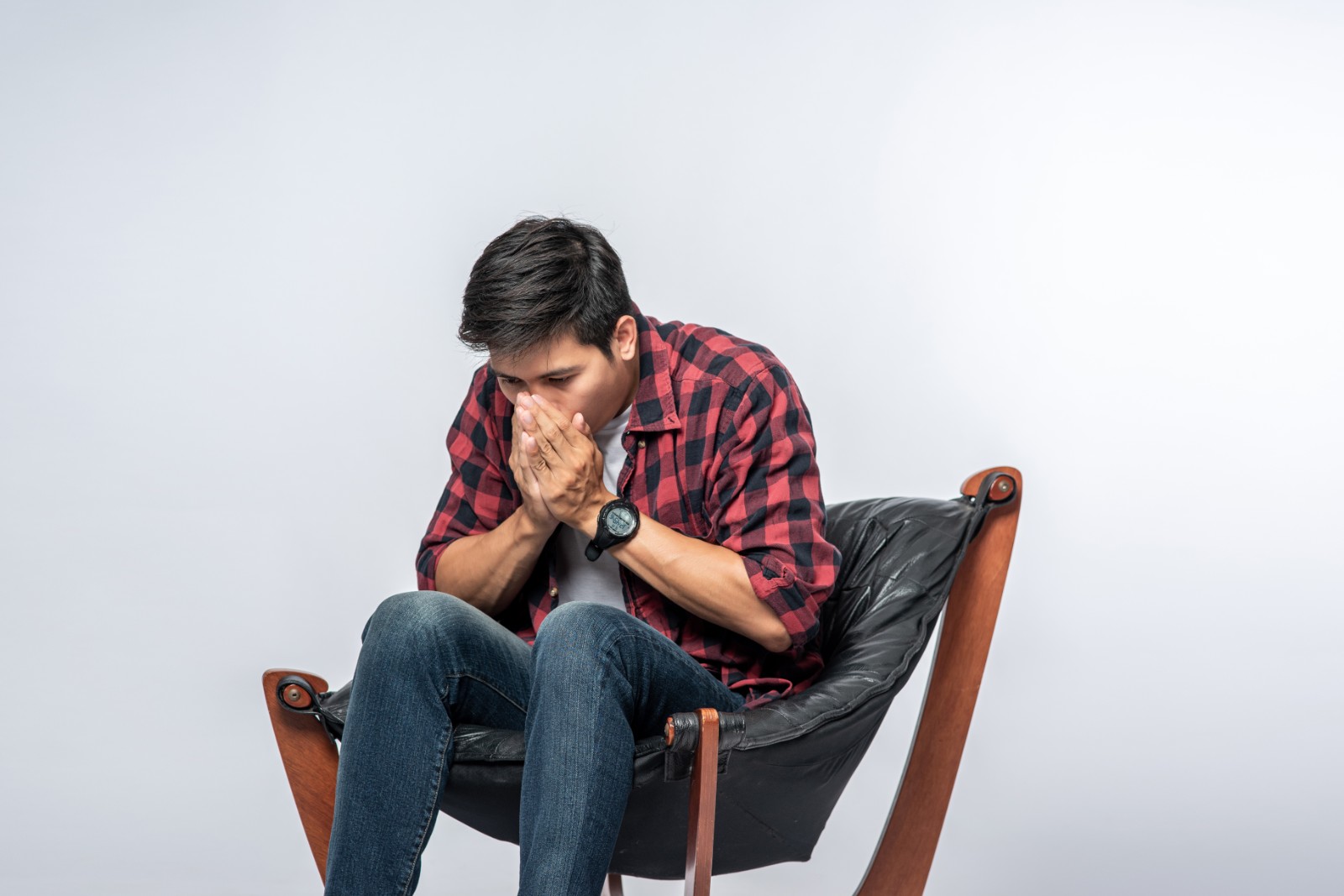 man-striped-shirt-sits-sick-sits-chair-crosses-his-arms.jpg